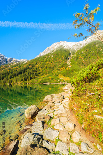 Fototapeta Naklejka Na Ścianę i Meble -  Morskie Oko lake in autum colors and snow peaks, Tatra Mountains, Poland