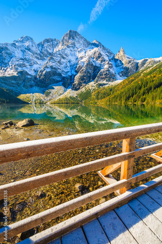 Morskie Oko lake in autum colors and snow peaks, Tatra Mountains, Poland