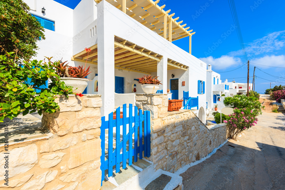 Street with typical Greek style apartments in Naoussa town on Paros island, Greece