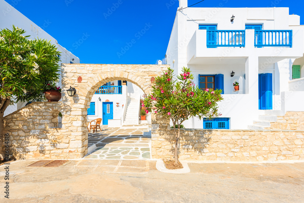 Entrance gate to typical Greek style apartment complex in Naoussa town on Paros island, Greece