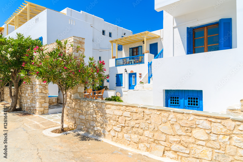 Typical Greek style apartments on street in Naoussa town on Paros island, Greece