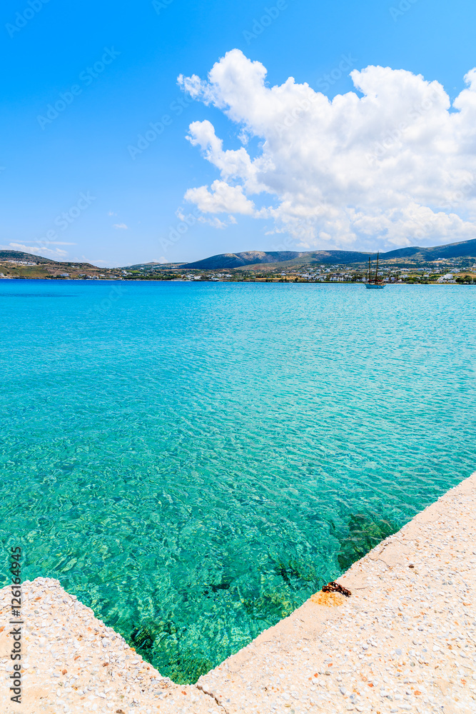 Fototapeta premium Pier and crystal clear azure sea water of Kolymbithres beach, Paros island, Greece