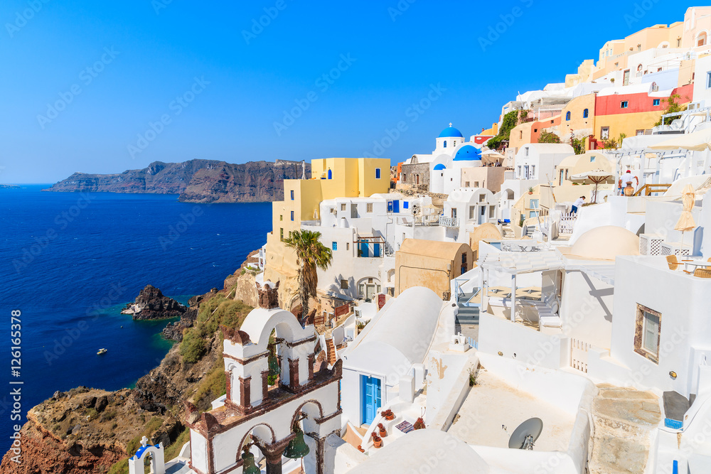 View of famous Oia village with colorful houses, Santorini island, Greece