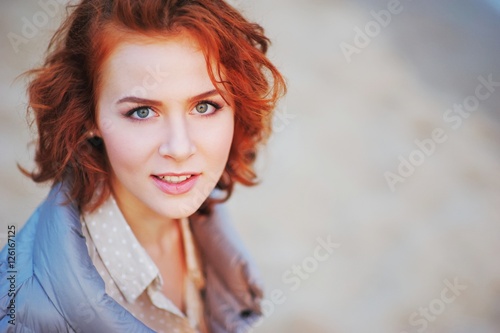 Stunning portrait of a young attractive girl with the most beautiful eyes in the open air, in close-up.