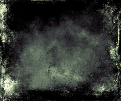 Beautiful abstract vintage grunge background with faded central area for your text or picture, scratched dark background