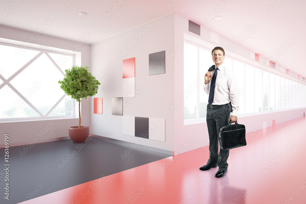 Businessman in modern corridor Businessman in modern corridor