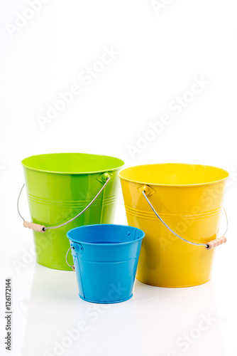 Set of empty iron/metal buckets/ pails/ containers with handle isolated on white background.Colorful kid,child toys.Home gardening equipment. For household  ideas, designs,themes, concepts. 