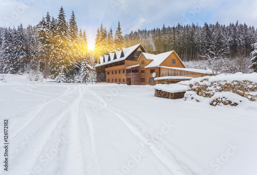 wooden houses on austrian mountains at winter © Ryzhkov Oleksandr