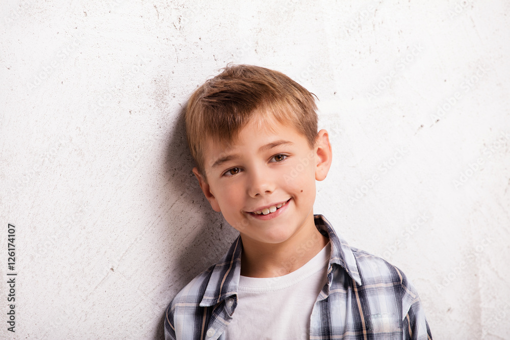 Portrait of little boy in studio.