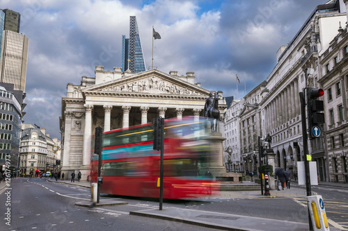 Bild auf Leinwand London, England - The Royal Exchange building with moving red double decker bus