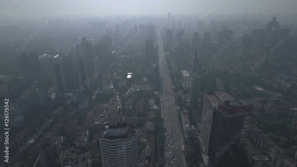 Aerial pan shot of the Changsha skyline with smog in the early morning