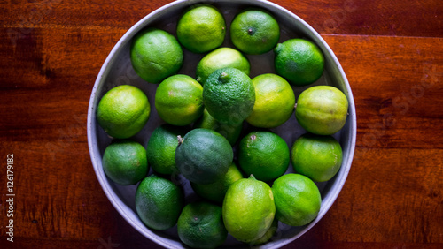 Bowl of Fresh Limes On Table
