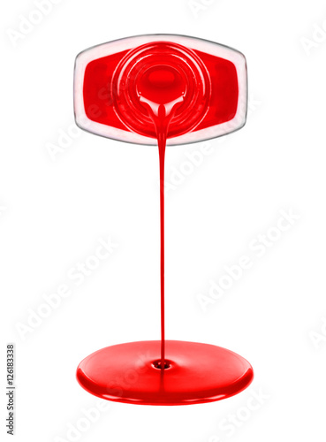 Фотография close up of red nail polish flow isolated on white background