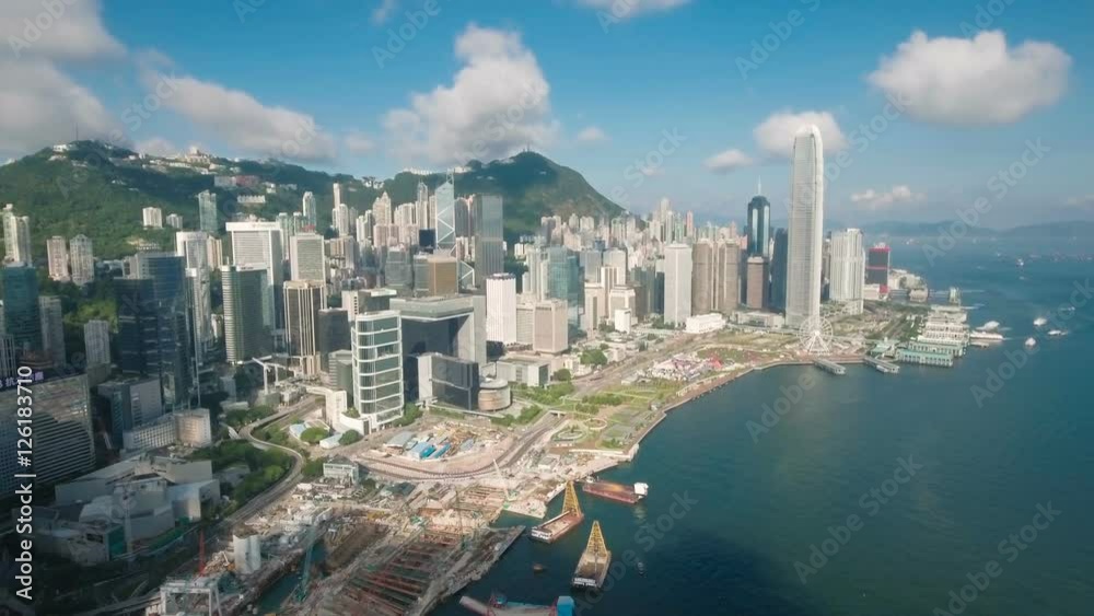 Aerial drone flight towards the iconic modern skyline of Hong Kong