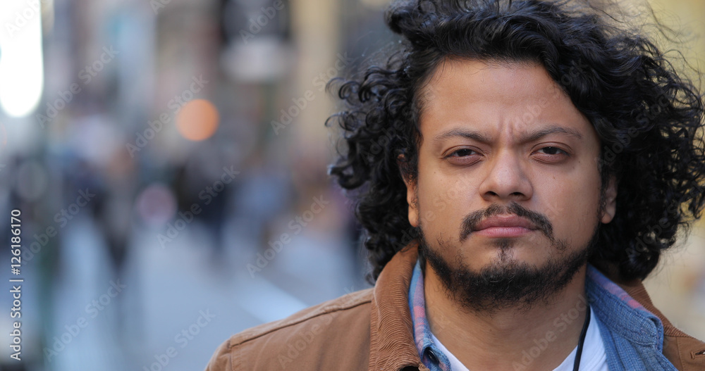 Fototapeta premium Latino hispanic man in city face portrait