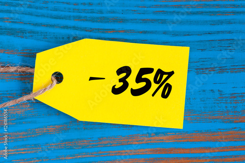 sale minus 35 percent. Big sales 35%, thirty five percents on blue wooden background for flyer, poster, shopping, sign, discount, marketing, selling, banner, web, header