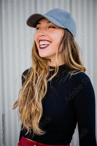 Girl laughing with gum out. photo