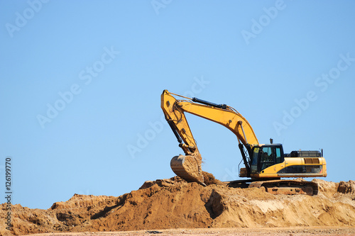 excavator in construction site photo