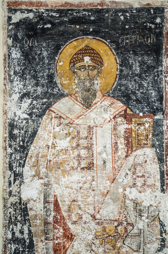 An ancient saint portrait drawing on the wall of Roman Church