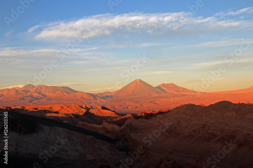 Valle de la Luna, valley of the moon, Volcan Lincancabur in the background, west of San Pedro, Atacama desert of Chile © reisegraf