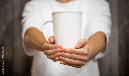 the girl holding a large Cup © puhimec