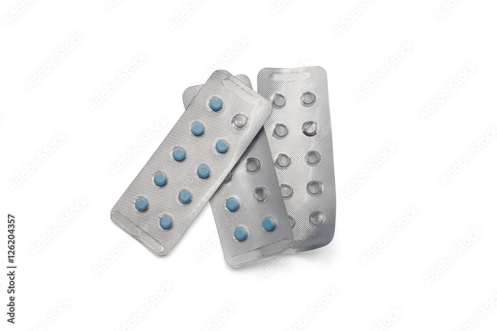 Blue pills in packages and empty packages from top view isolated on white background Blue pills in packages and empty packages from top view isolated on white background