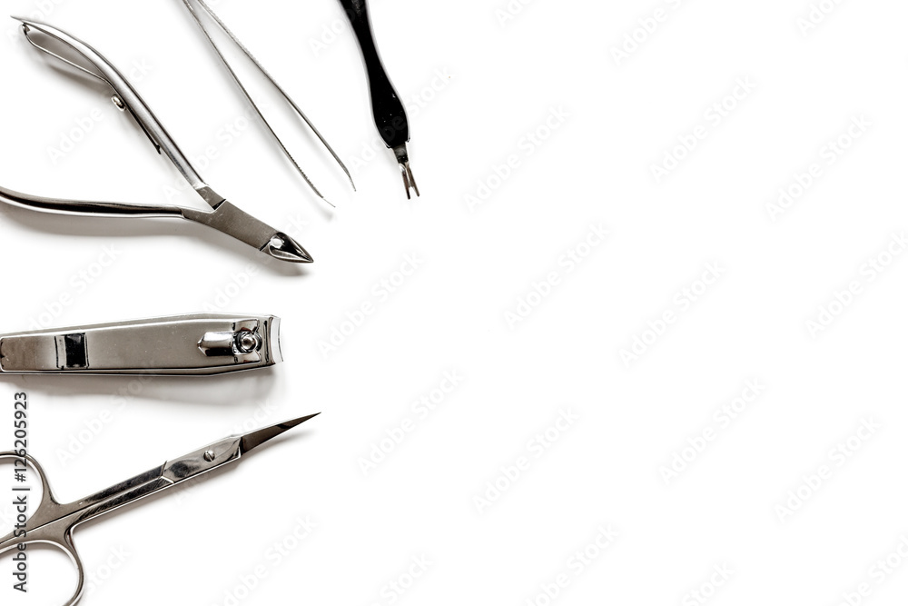 Tools of a manicure set on white background top view Tools of a manicure set on white background top view
