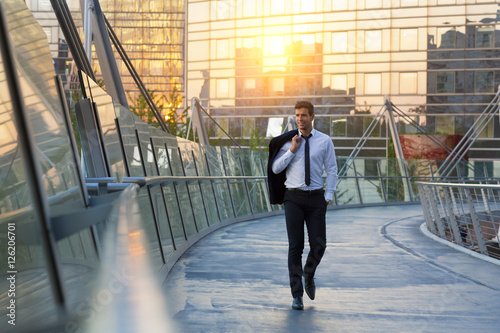 Businessman walking in financial district