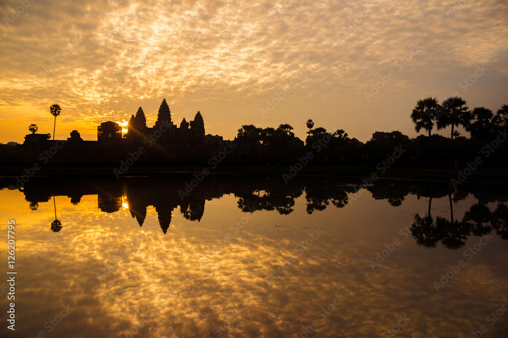 Fototapeta premium The silhouette of Angkor Wat before sunrise in Siem Reap province of Cambodia.