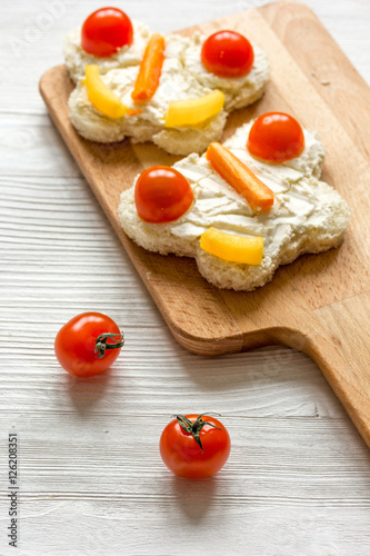 cooking shaped sandwiches for children on wooden background