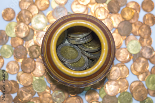Thai coins in a jar.