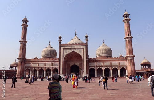 Jama Masjid of Delhi, is one of the largest mosques in India. Unidentified people walk in courtyard of Jama Masjid located in Old Delhi, India. 