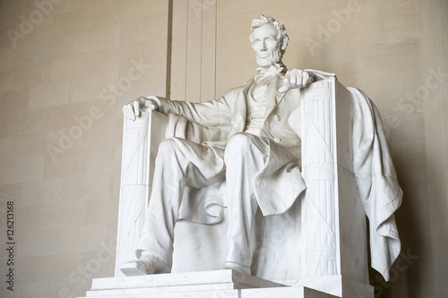 Statue of American president Abraham Lincoln seated in white marble at Lincoln Memorial in Washington DC, USA 