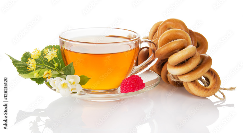Bunch bagel, cup tea, raspberry, jasmine and linden flowers isolated .