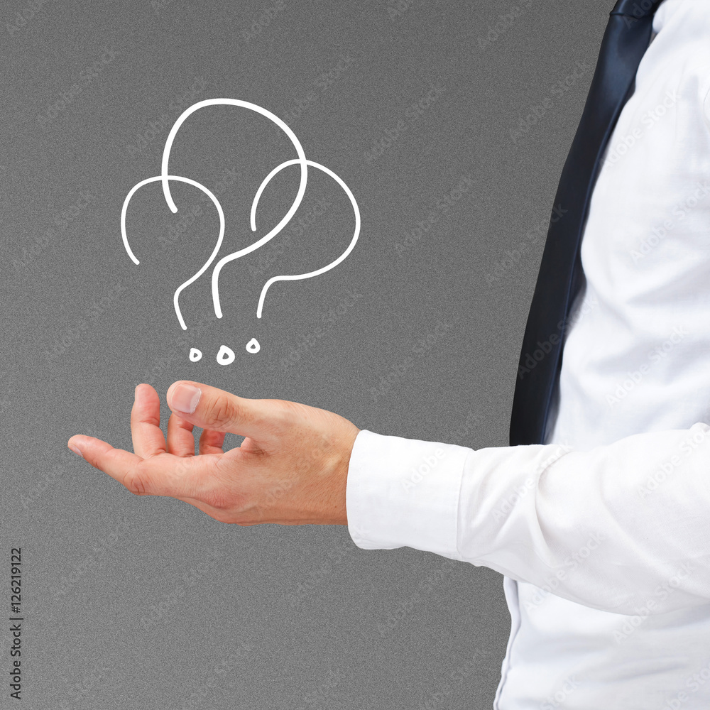 Question mark on businessman hand.
