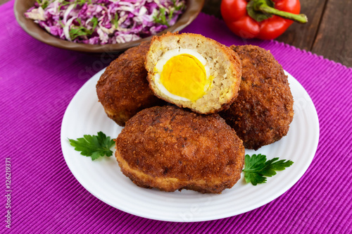Meat mini-rolls (cutlet) with boiled egg. Close up
