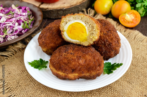 Meat mini-rolls (cutlet) with boiled egg. Close up