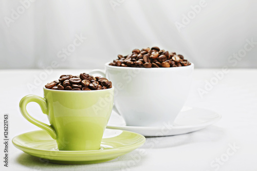 Coffee beans in different cups closeup