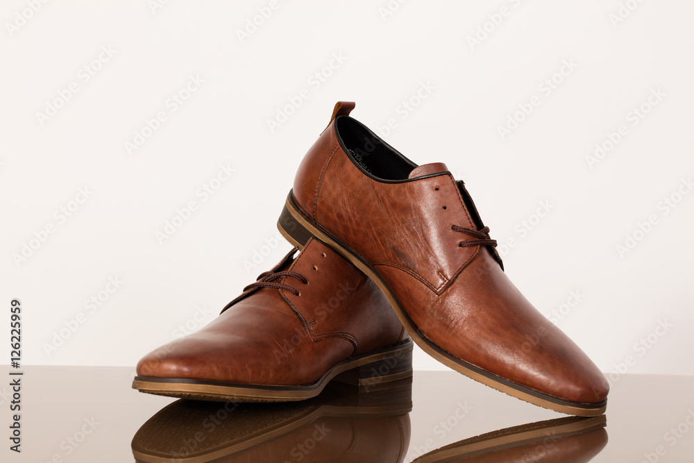 Brown leather shoes for men on a white background