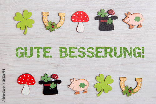 Hintergrund mit Glückssymbolen-Gute Besserung