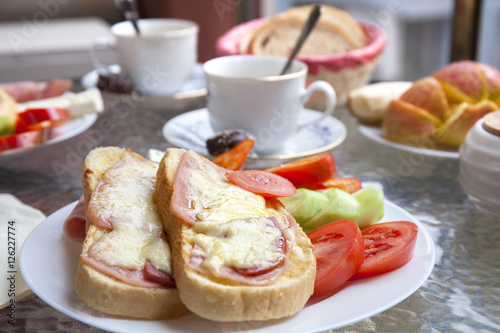 Delicious Breakfast with Sandwiches and Vegetables and Fruits on the Terrace