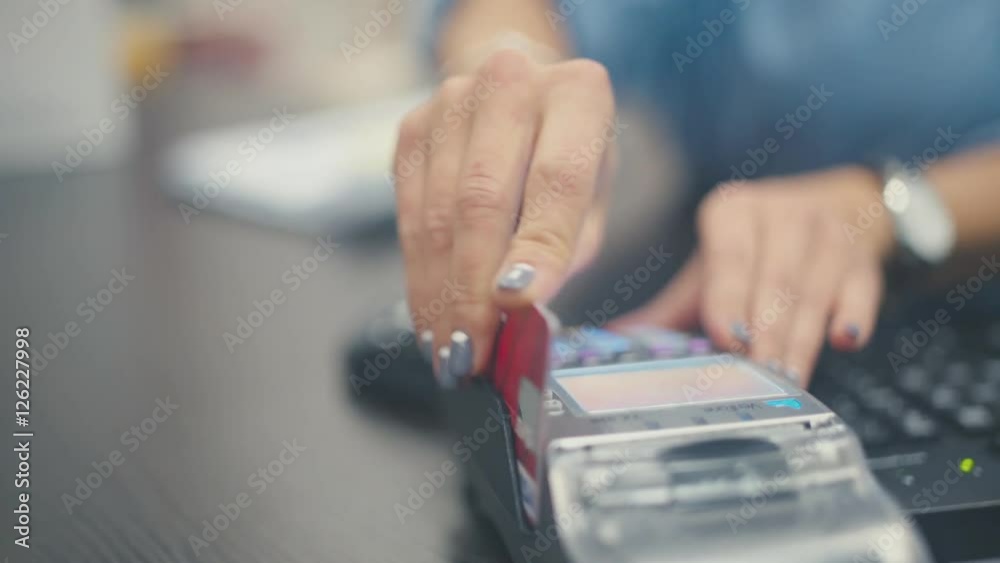 Close Up: Credit card payment terminal. Transfer payment. Payment purchases by credit card. Modern methods of purchase. Bank terminal. Banking services. Money. Payment of purchase. Close Up: Credit card payment terminal. Transfer payment. Payment purchases by credit card. Modern methods of purchase. Bank terminal. Banking services. Money. Payment of purchase.