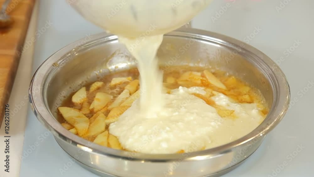 Chef is cooking cheesecake with caramelized apple Chef is cooking cheesecake with caramelized apple