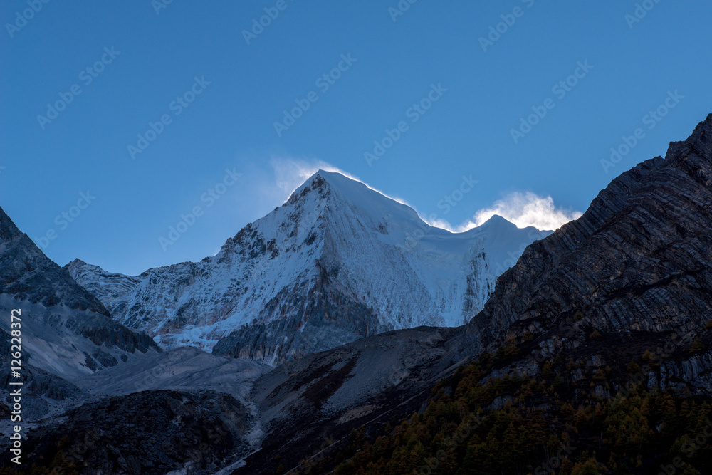 Holy snow mountain at Yading national level reserve in Daocheng County, in the southwest of Sichuan Province, China.
