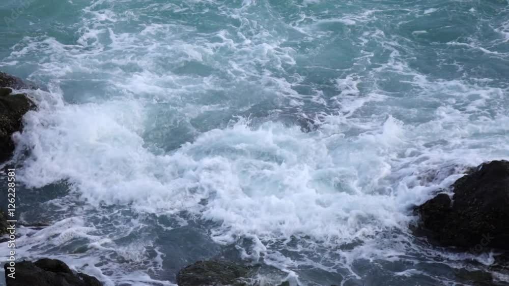 Slow motion of sea swash between rocks. Meditative view of water stream, foam, splash and textured boulder. Beautiful background for amazing intro in excellent full HD clip with fourfold deceleration. Slow motion of sea swash between rocks. Meditative view of water stream, foam, splash and textured boulder. Beautiful background for amazing intro in excellent full HD clip with fourfold deceleration.
