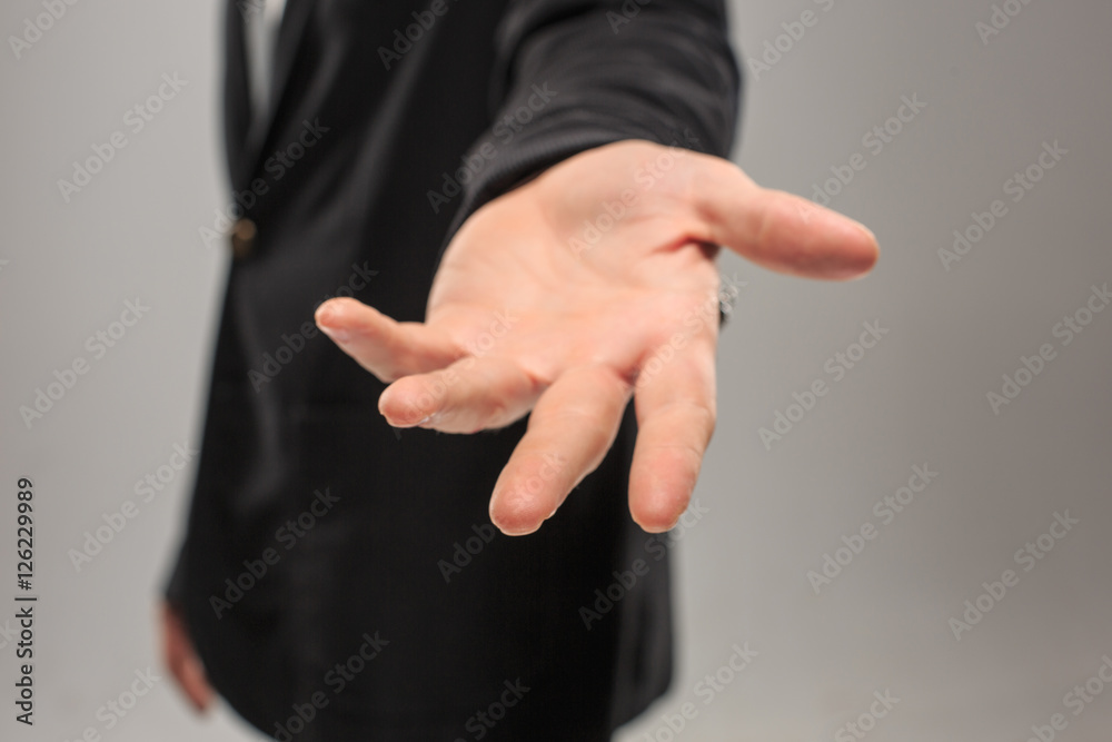 Obraz premium Dressed in a business suit caucasian male hand