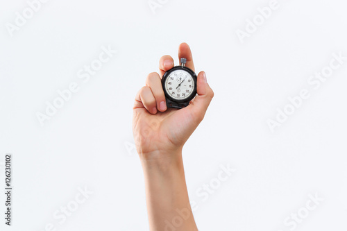 hand holding a stopwatch against a white background