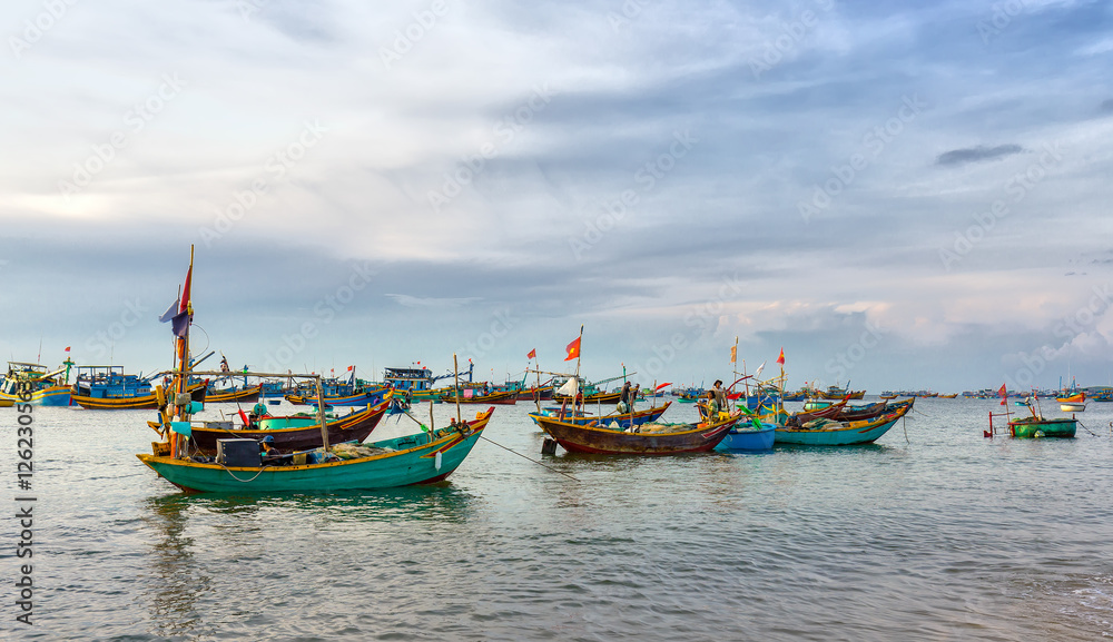 Phan Thiet, Vietnam - July 26th, 2016: Pier fishing at Mui Ne beach in the morning when the fishermen prepare for a trip out to sea full of fish caught Phan Thiet, Vietnam - July 26th, 2016: Pier fishing at Mui Ne beach in the morning when the fishermen prepare for a trip out to sea full of fish caught