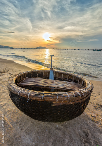 Basket boat before dawn as the sun slowly rise to express the rest of the season when fishermen fish on, languish waiting to be put to sea