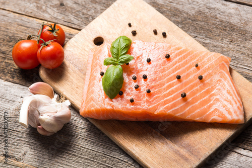 Raw salmon fillet with herbs